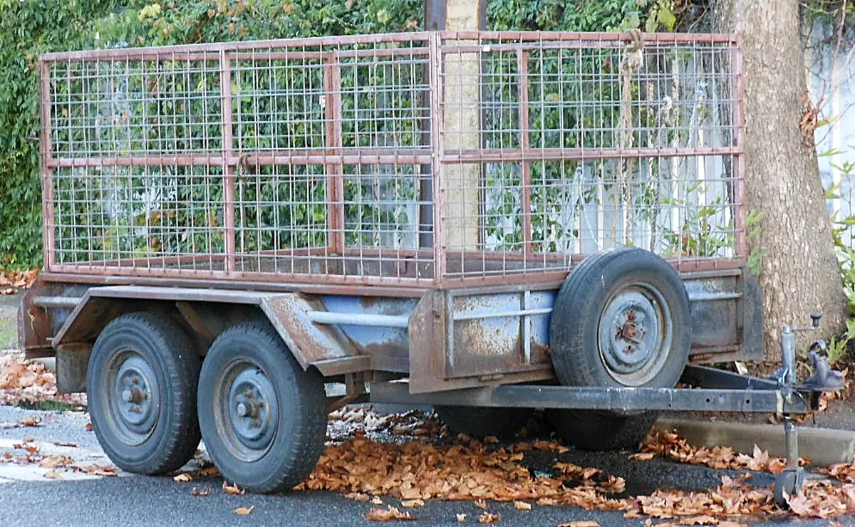 A caged box trailer, representative of the model in the fleet