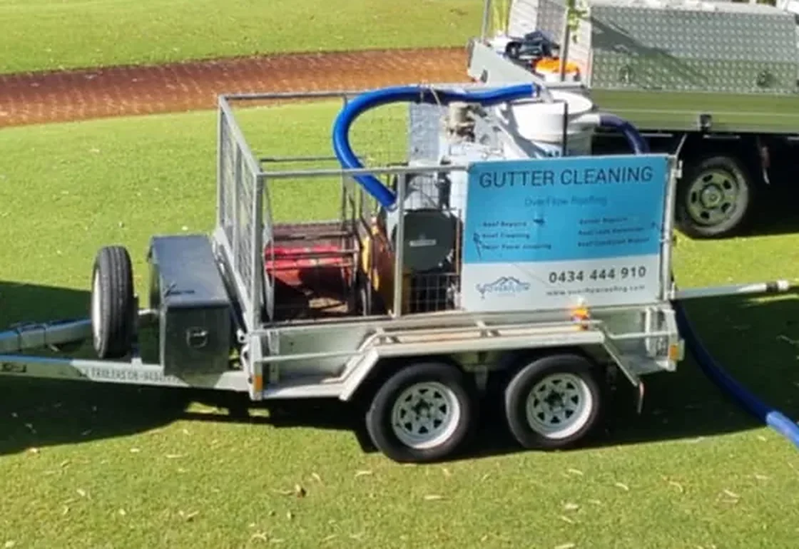 Overflow Group WA branded gutter cleaning trailer with the vacuum unit and hose reel
